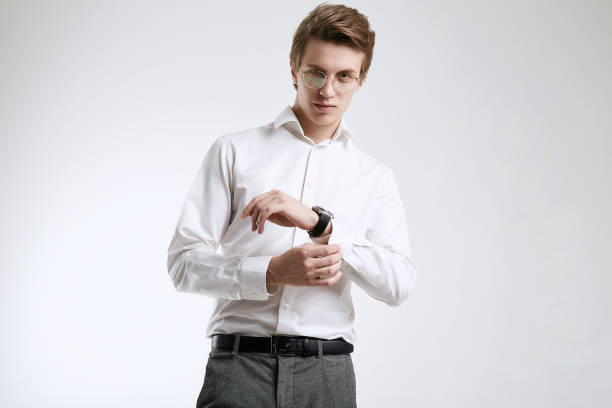 istock Confident young handsome businessman in shirt isolated on white background 1152249056