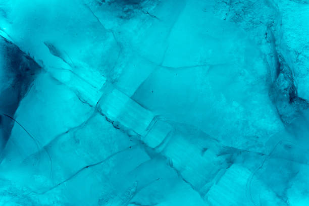 istock Ice texture background macro close up in sunlight. Beautiful abstract patterns of frozen water. 1152249455