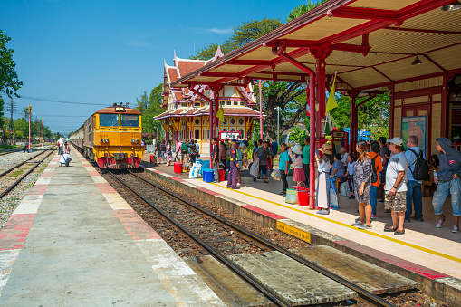 Hua Hin, Thailand - 27 January 2019: Hua Hin Railway Station is the most beautiful train station in Thailand with trains and people on the platform.