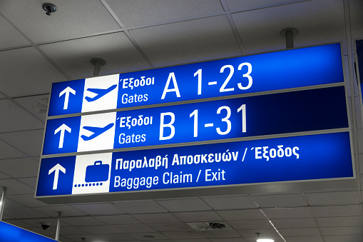 Athens, Greece. Exit, baggage claim and gate signs at the Athens International Airport Eleftherios Venizelos ATH
