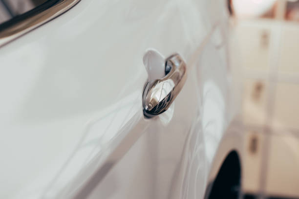 istock Closeup of white car door handle 1152253478