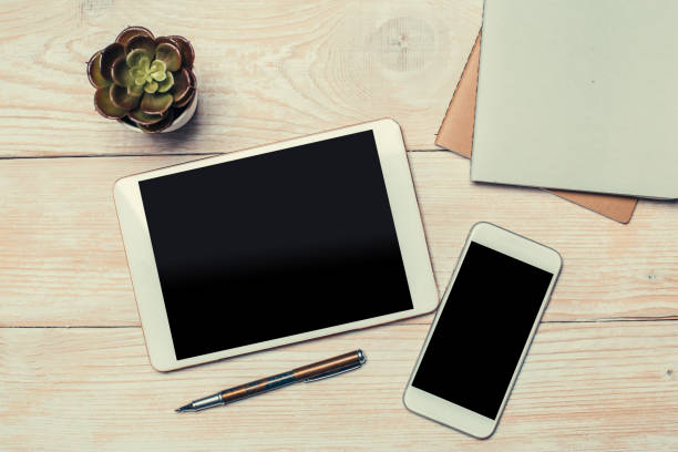 istock Modern Tablet and smartphone top view on office desk. Top view with copy space. 1152253612