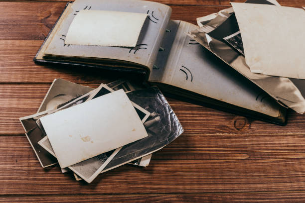 istock Stack old photos on table. Mock-up blank paper. Postcard rumpled and dirty vintage. Retro card 1152253670