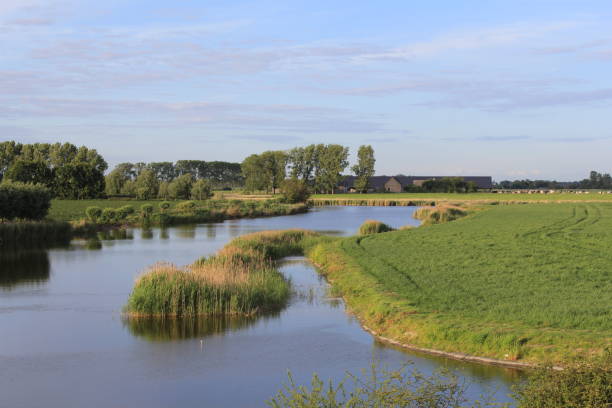 istock a beautiful creek in the dutch landscape with a blue sky 1152256561