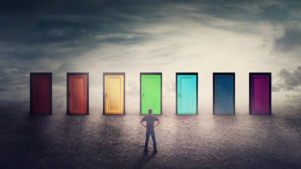 istock Confident guy in front of many doors different colored has to choose one 1152260837