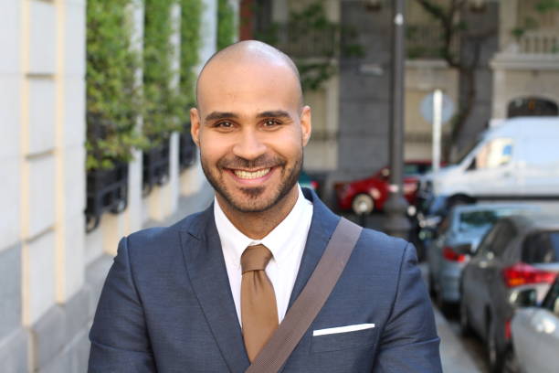 istock Elegant bald man smiling outdoors 1152263636