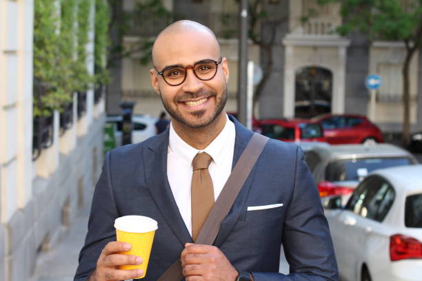 istock Elegant bald man smiling outdoors 1152263638