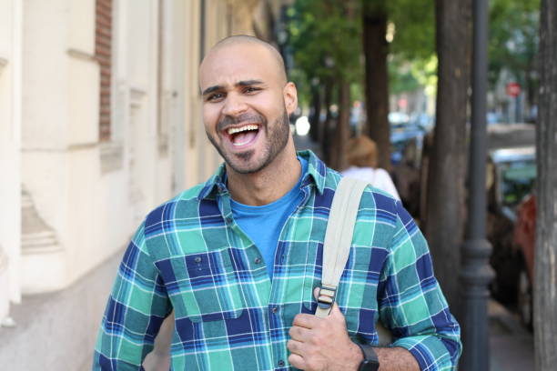 istock Ethnic man laughing out loud outdoors 1152263688