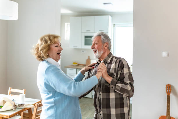 istock Happy elderly woman and a man dancing 1152265387