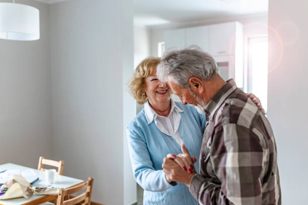 istock Senior couple laughing and having fun dancing 1152265853