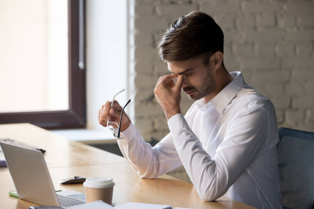 istock Millennial office worker taking off eyeglasses suffers from eyes strain 1152268801