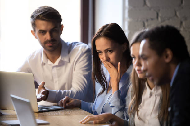 istock Surprised baffled diverse colleagues received bad news by email 1152268815