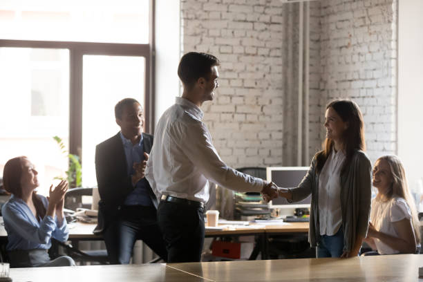 istock Boss congratulating female employee congratulating with promotion 1152268838