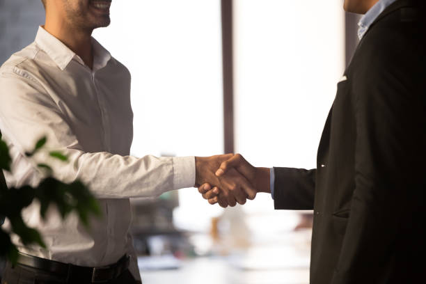 istock Close up of client and executive manager shaking hands 1152268840