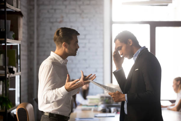 istock Angry director criticizing financial report accusing african man employee 1152268859
