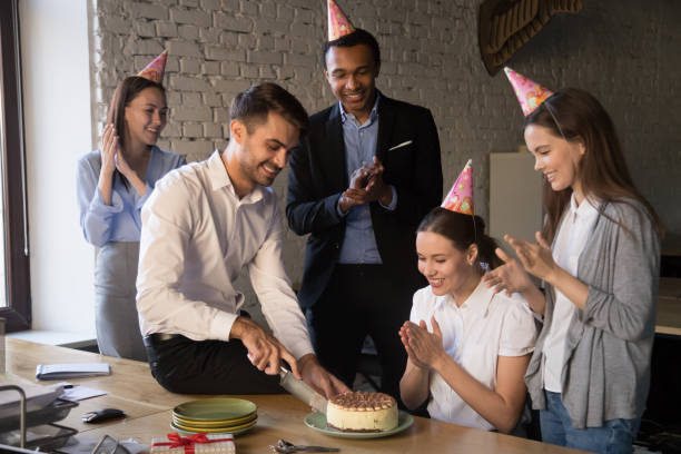 istock Happy joyful diverse colleagues celebrating birthday of workmate 1152268886