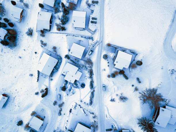 Amazing aerial shot with the drone over La Tzoumaz, Switzerland, on a cold dark january day.