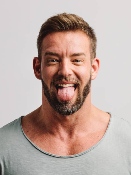 istock Handsome man sticking his tongue out 1152270568