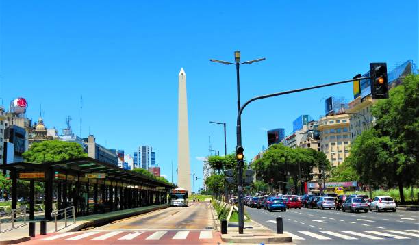 the 9 de julio avenue (avenida 9 de julio) with metrobus station and cars at avenue. - ninth avenue imagens e fotografias de stock