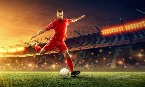 istock Soccer player in action. Night soccer stadium. 1152272017