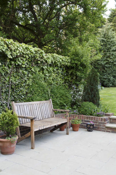 istock Garden with bench and patio 1152273013