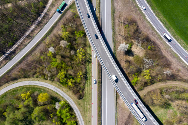 istock Aerial View of Semi Trucks on Highway Intersection 1152273386