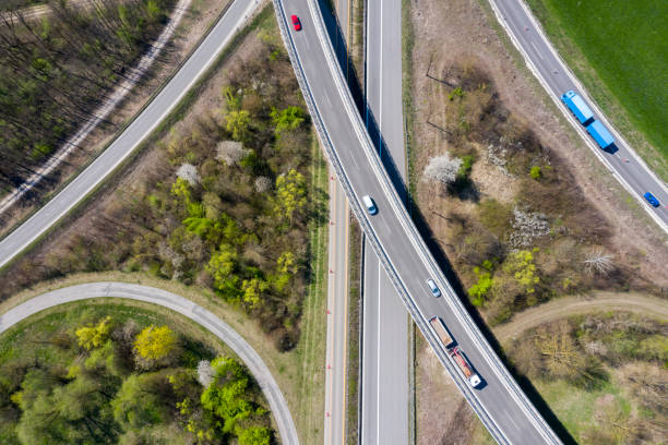 istock Aerial View of Semi Trucks on Highway Intersection 1152273513