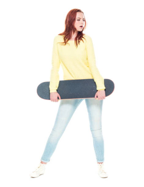 istock Cute female holding a skateboard 1152273529