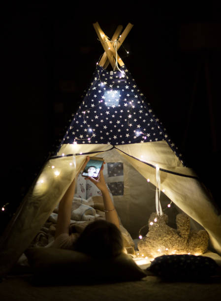 istock Happy kids having party in tent 1152274259