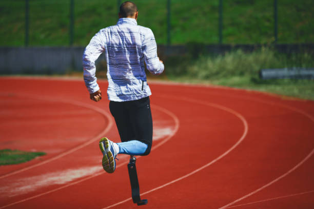 istock Young athlete running at stadium track. 1152280073