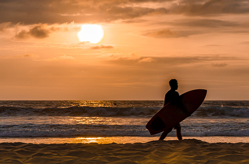 Dawn on a beach of surfers in the pacific ocean. mountain ecuador