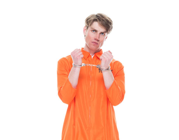 istock Male prisoner wearing handcuffs 1152281506