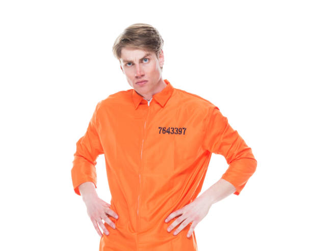 istock Male prisoner wearing orange jumpsuit 1152281510