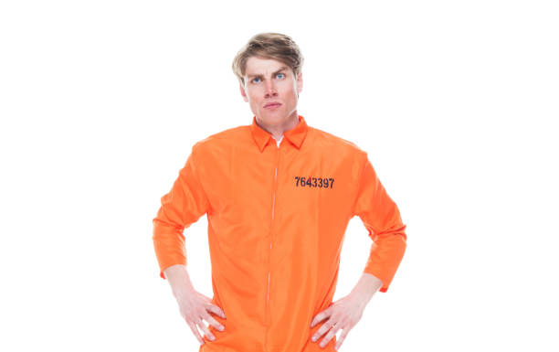 istock Male prisoner wearing orange jumpsuit 1152281522
