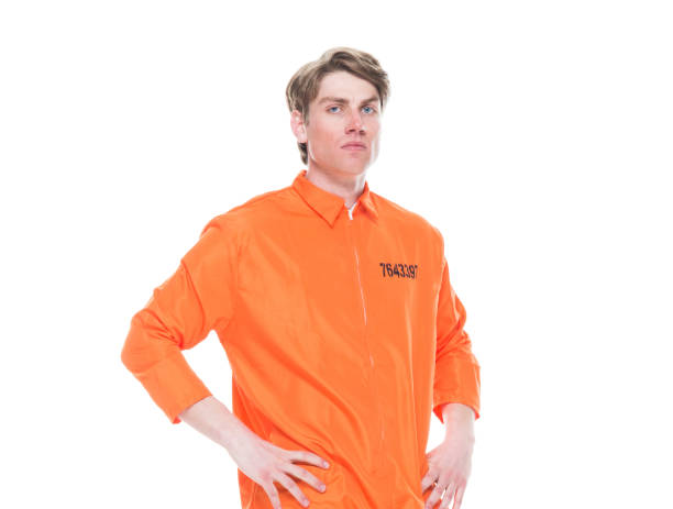 istock Male prisoner wearing orange jumpsuit 1152281523