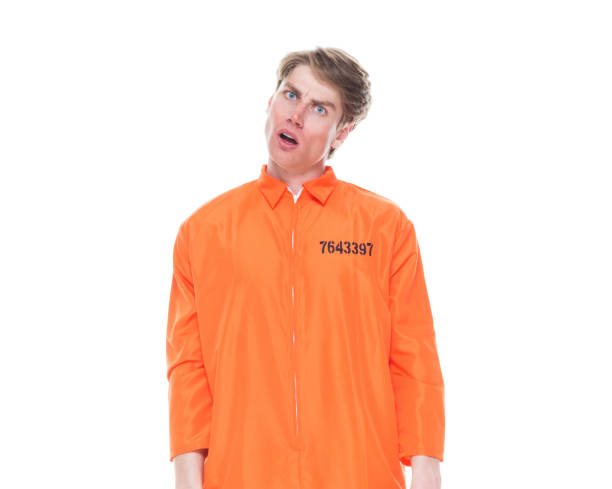 istock Male prisoner wearing orange jumpsuit 1152282033