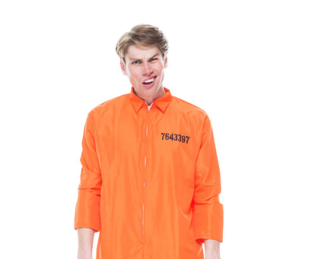 istock Male prisoner wearing orange jumpsuit 1152282049