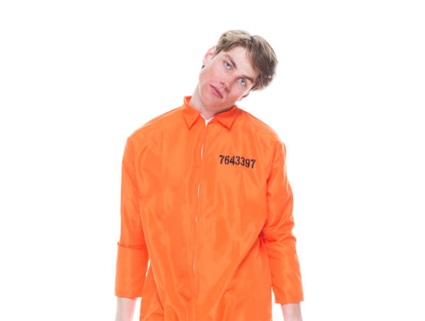 istock Male prisoner wearing orange jumpsuit 1152282051