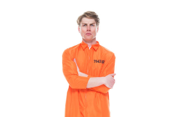 istock Male prisoner wearing orange jumpsuit 1152282052