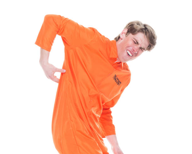 istock Male prisoner wearing orange jumpsuit 1152282065