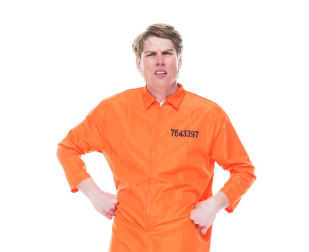 istock Male prisoner wearing orange jumpsuit 1152282071