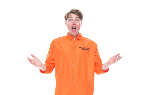 istock Male prisoner wearing orange jumpsuit 1152282081