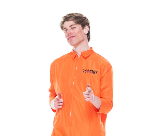 istock Male prisoner wearing orange jumpsuit 1152282084