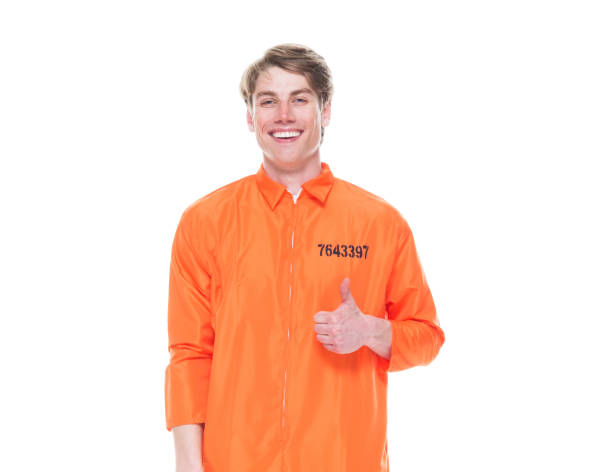 istock Male prisoner wearing orange jumpsuit 1152282089