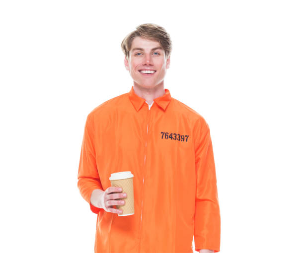 istock Male prisoner wearing orange jumpsuit 1152282099