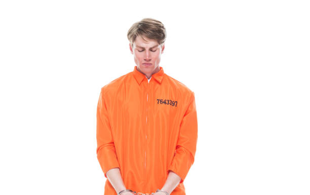 istock Male prisoner wearing handcuffs 1152282117