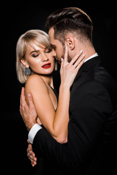 istock beautiful tender couple embracing isolated on black 1152285390