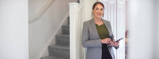 istock Smiling estate agent in property 1152286837