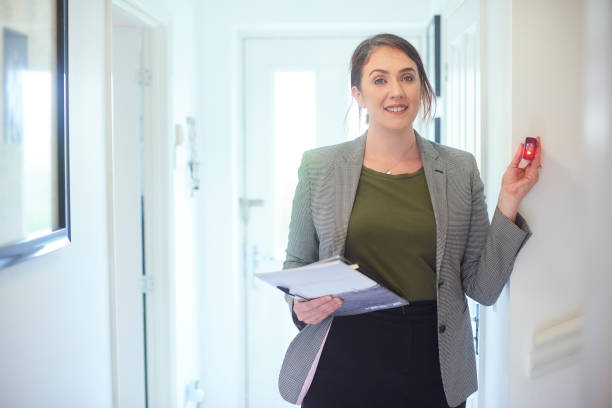 istock Estate agent measuring rooms with laser measuring device 1152286929