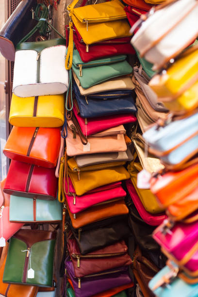 istock colorful woman handbag purses hanging on store front 1152290450